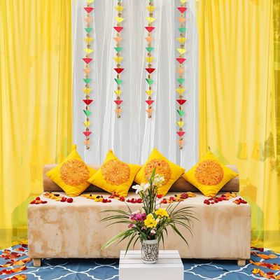 White and Yellow Net Backdrop with Triangle Hanging for Haldi Mehndi | Party Propz