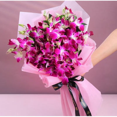 Purple Orchids Bouquet in Pink Wrap