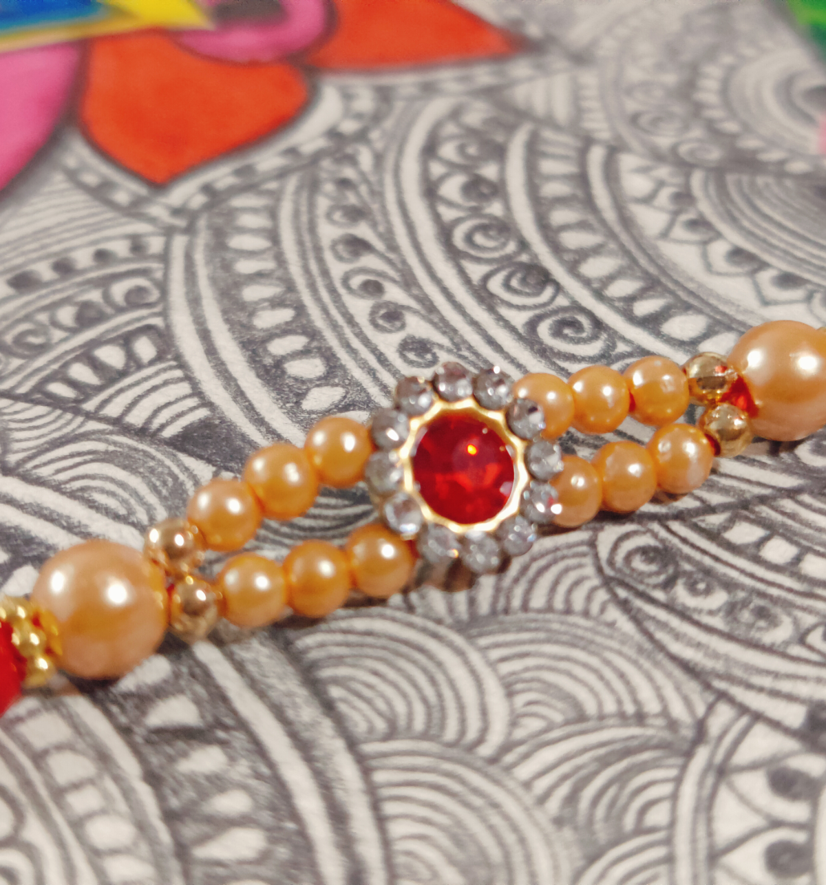 House Of Festivals Mauli Rakhi With Red Sparkling Stones & Moti