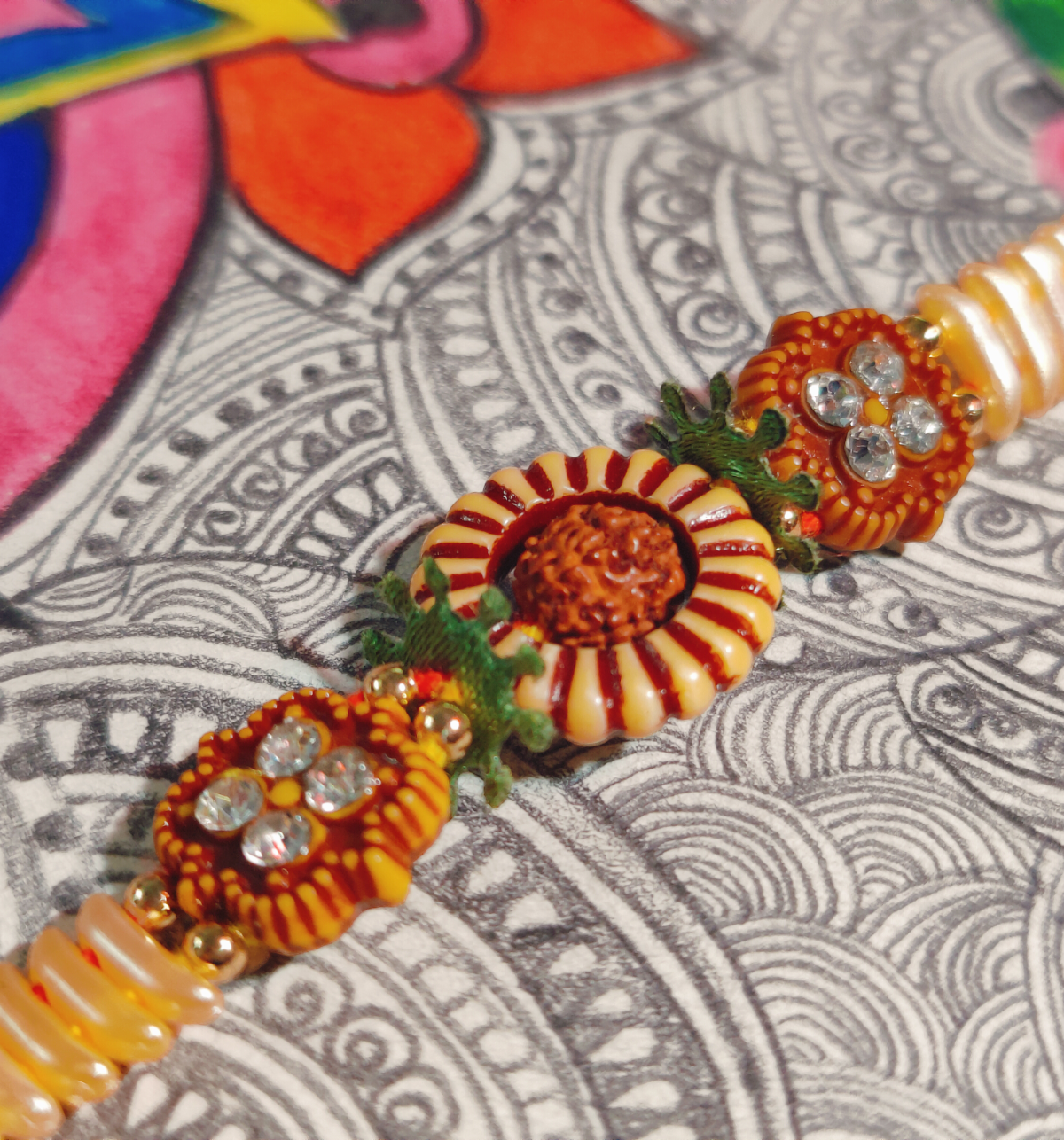 House Of Festivals Rudraksh Sun Design Rakhi with Sparkling Stones - Divine and Shiny
