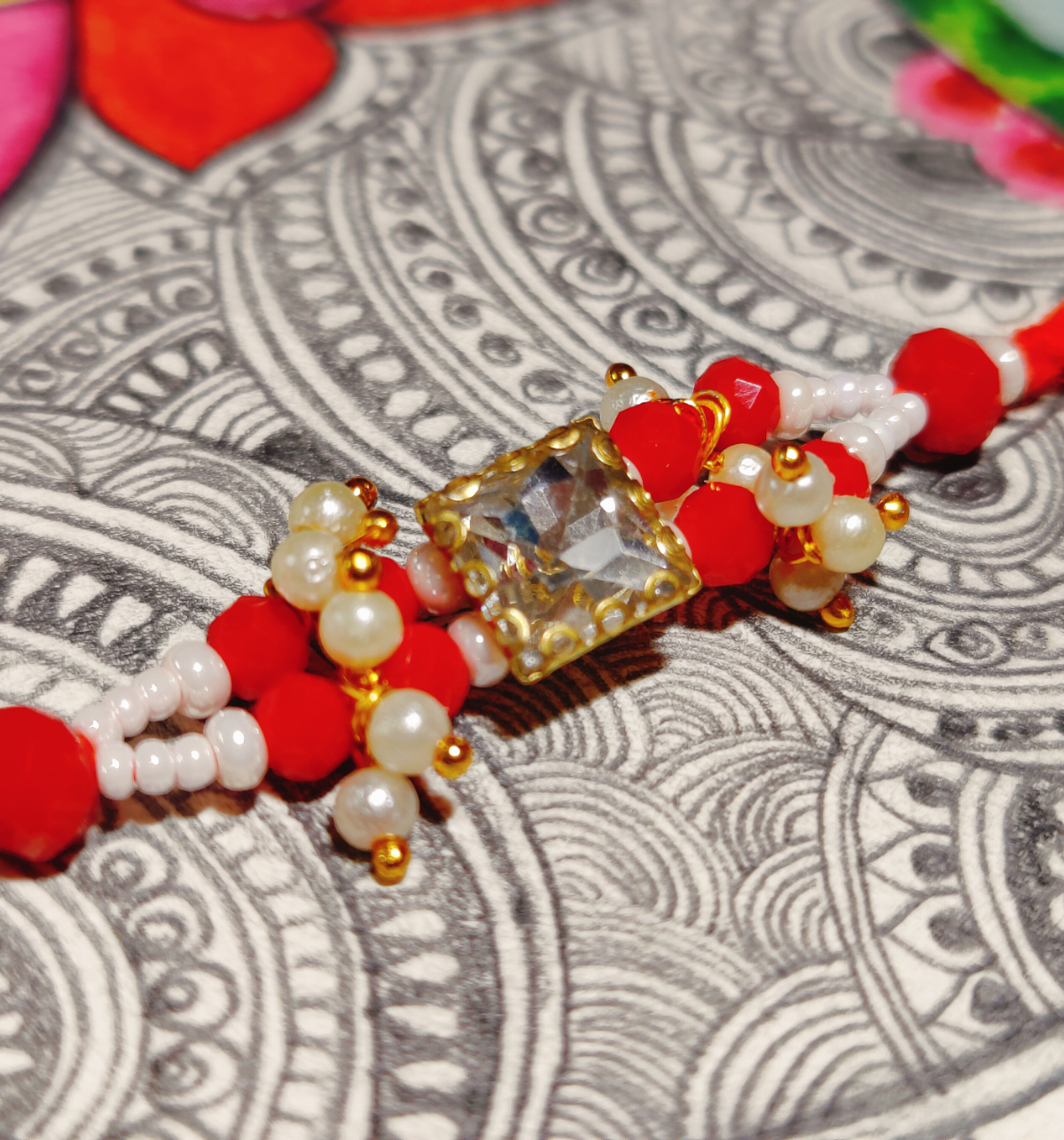 House Of Festivals Premium Sparkling Stone Rakhi with Intricate Moti Design - Elegant Craft