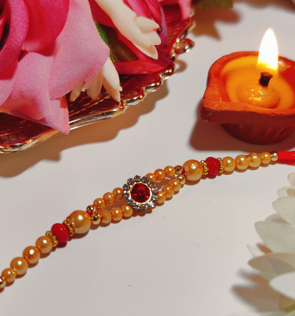 House Of Festivals Mauli Rakhi With Red Sparkling Stones & Moti