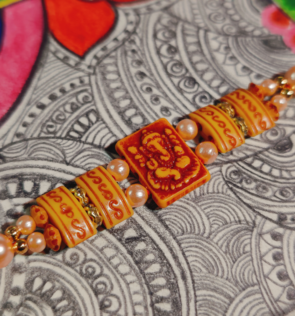 House of Festivals Ganesh Pendant Rakhi - Double Moti Dori
