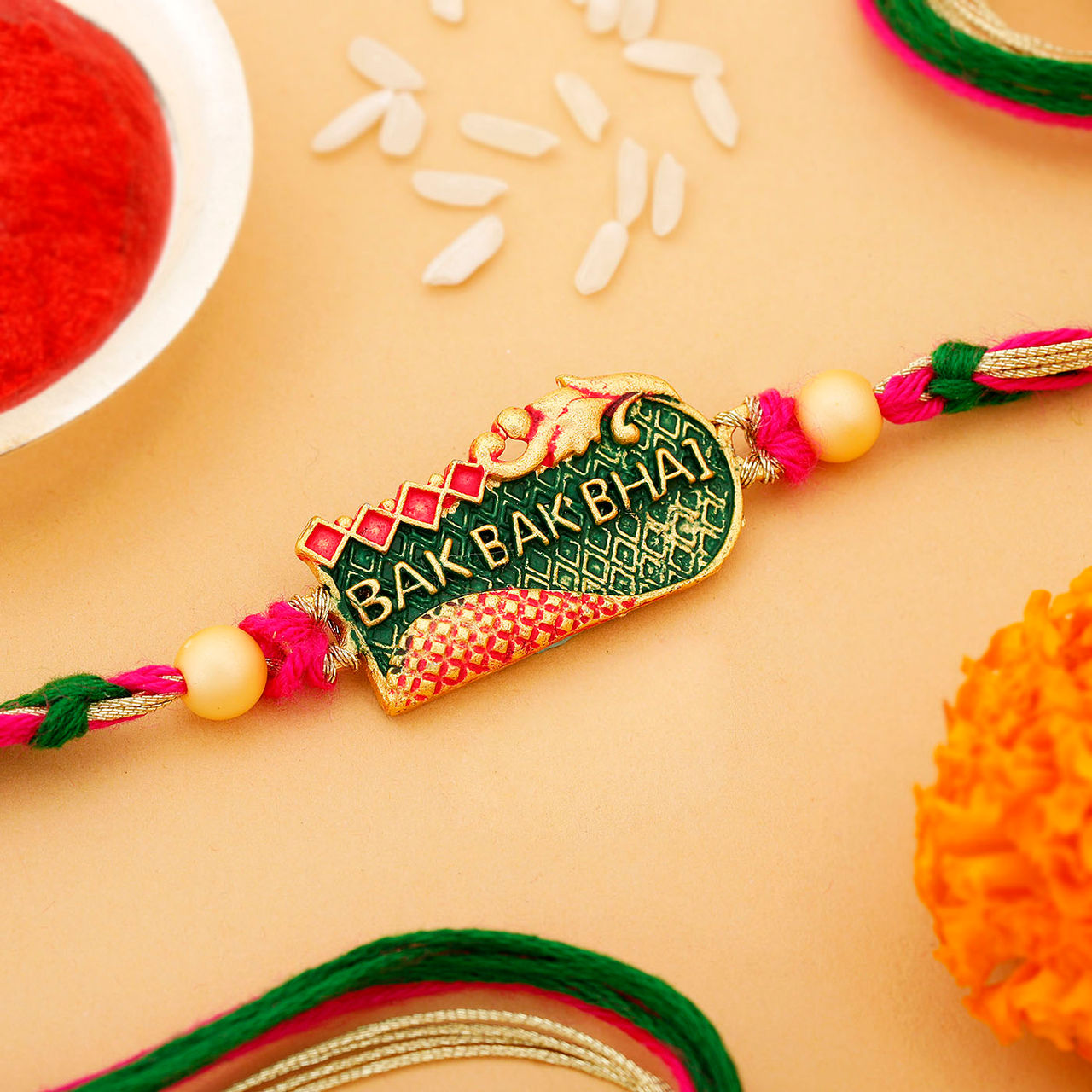 IGP Enamelled Pendant Rakhi - Simple and Elegant
