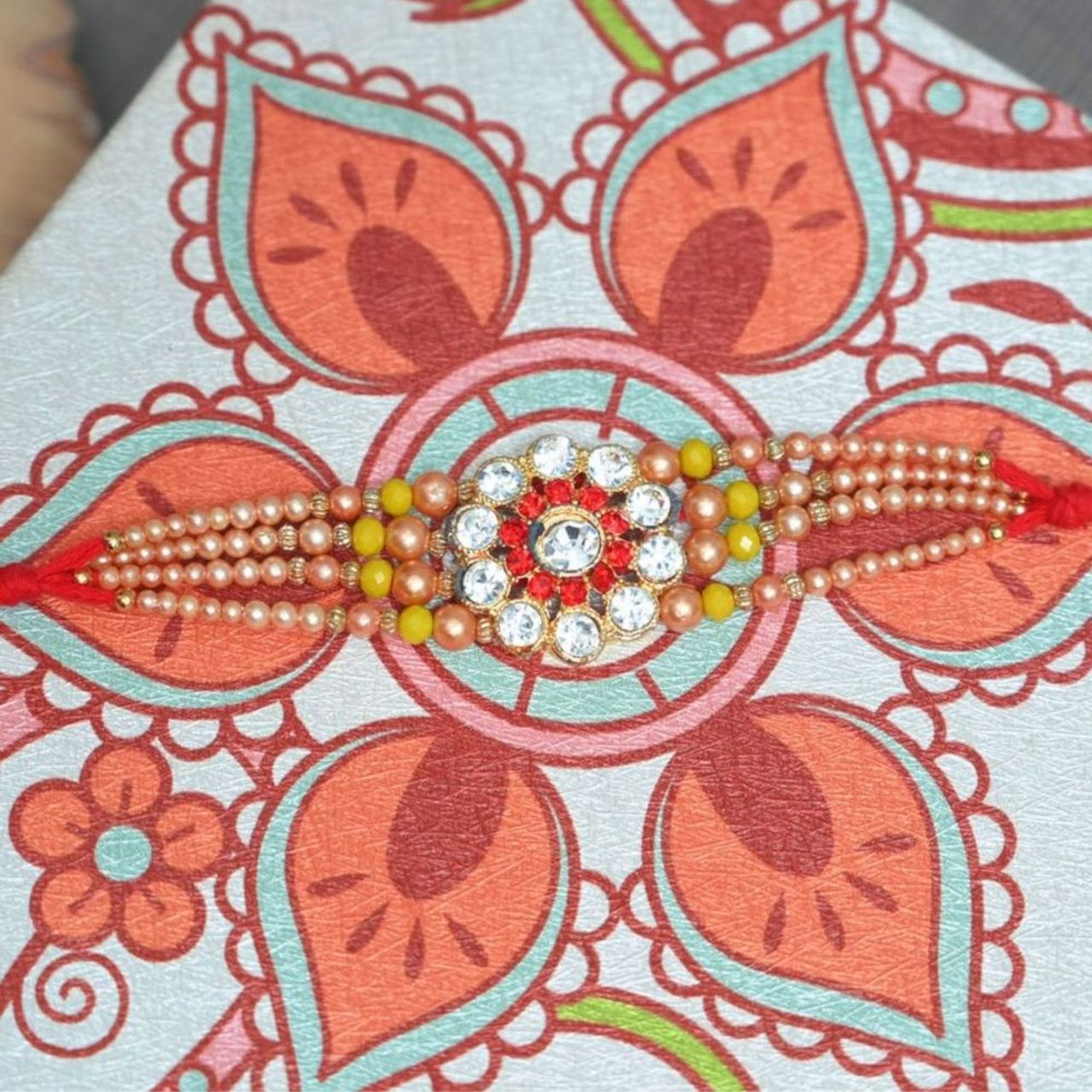 Daadi'S Kaju Katli 500G(500gms) & Aurum Diamond Rakhi With 3 Line Pearls(1pc) Combo