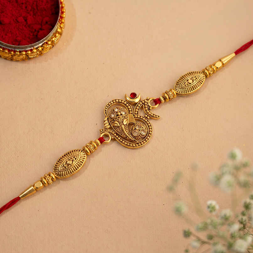 Religious Golden Beads, Om Symbol Designer Rakhi for Brother & Roli Chawal | Pack of 1 | Ecraftindia Religious Golden Beads, Om Symbol Designer Rakhi for Brother & Roli Chawal | Pack of 1 | Ecraftindia