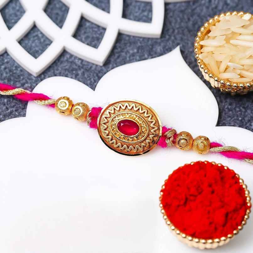 Kundan Designer Rakhi Golden Pink Beads with Roli Chawal | Pack of 1 | Ecraftindia Kundan Designer Rakhi Golden Pink Beads with Roli Chawal | Pack of 1 | Ecraftindia