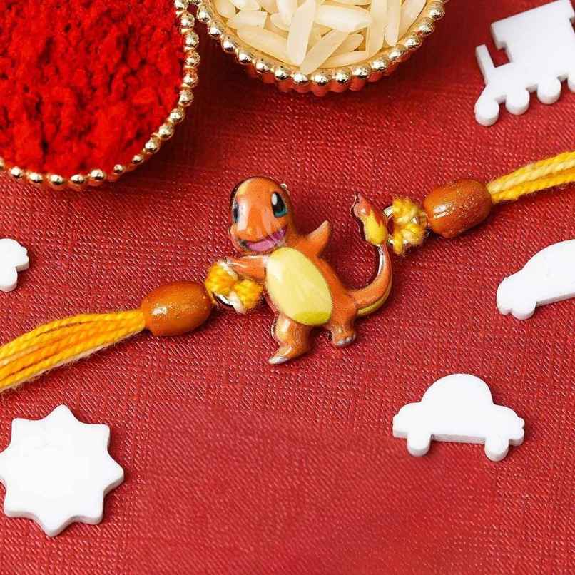 Kids Charmander Pokemon Rakhi for Bhai, Bhaiya with Roli Chawal Pack (eCraftIndia) Kids Charmander Pokemon Rakhi for Bhai, Bhaiya with Roli Chawal Pack (eCraftIndia)