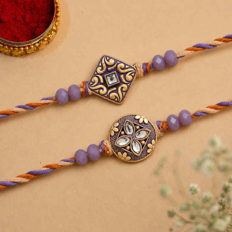 Stone Purple and Golden Precious Stone Designer Rakhis & Roli Chawal Pack (eCraftIndia) Set of 2 Stone Purple and Golden Precious Stone Designer Rakhis & Roli Chawal Pack (eCraftIndia) Set of 2