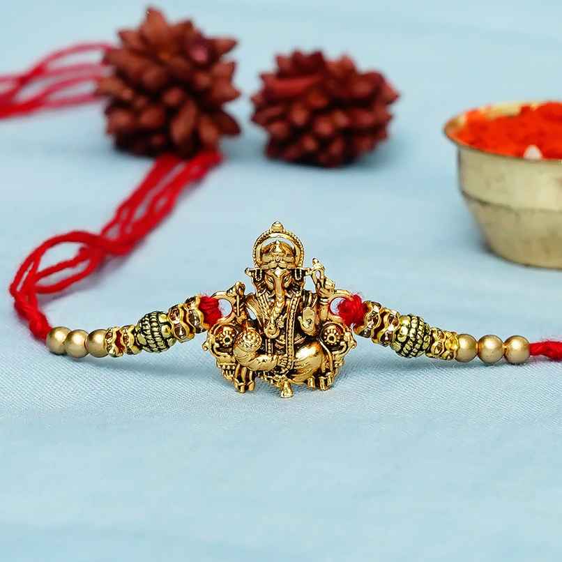 Rakhi for Brother | Golden Designer Ganesha | Religious | Includes Roli Chawal | Pack of 1 | Ecraftindia