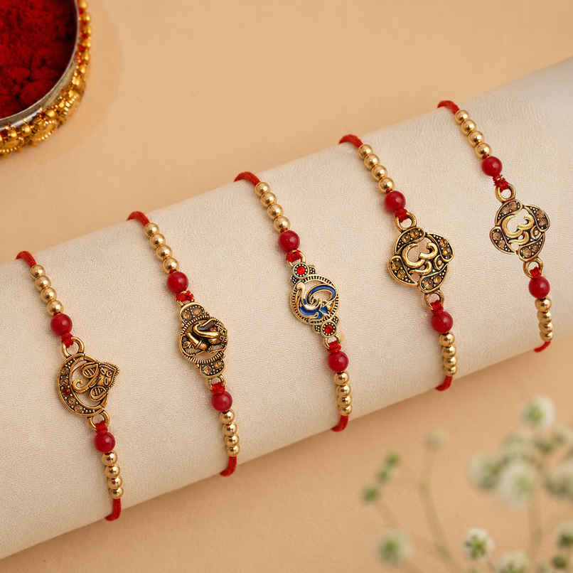 Religious Red & Golden Om Symbol and Lord Ganesha Designer Rakhis & Roli Chawal Pack (eCraftIndia) Set of 5 Religious Red & Golden Om Symbol and Lord Ganesha Designer Rakhis & Roli Chawal Pack (eCraftIndia) Set of 5