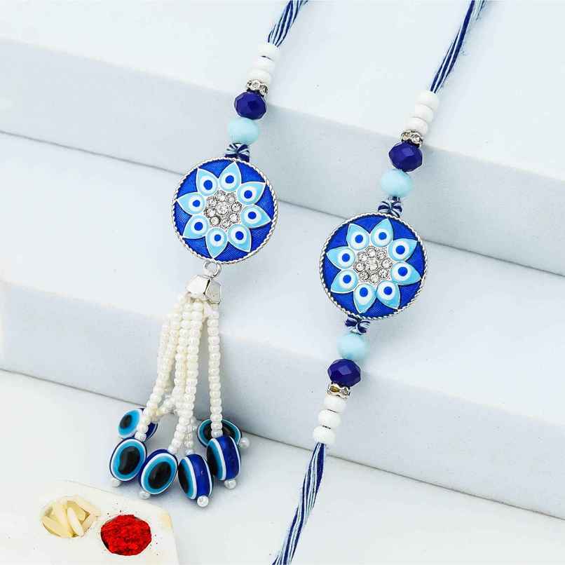 Bhaiya Bhabhi Floral Evil Eye Designer Lumba Rakhis for Bhaiya and Bhabhi (eCraftIndia) Set of 2 Bhaiya Bhabhi Floral Evil Eye Designer Lumba Rakhis for Bhaiya and Bhabhi (eCraftIndia) Set of 2