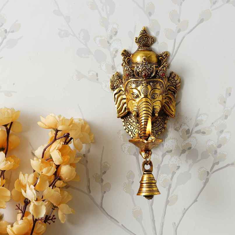 Golden Metal Lord Ganesha Face Wall Hanging Diya With Bell | eCraftIndia Golden Metal Lord Ganesha Face Wall Hanging Diya With Bell | eCraftIndia