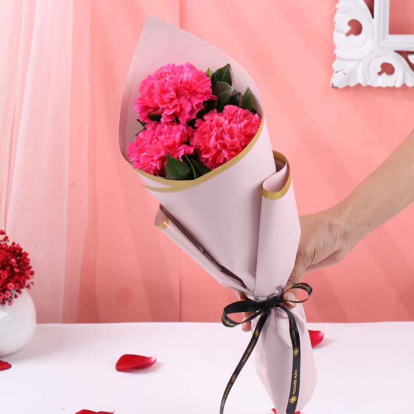 FlowerAura 3 Pink Carnations Bouquet in Pink Premium Paper | Gifting FlowerAura 3 Pink Carnations Bouquet in Pink Premium Paper | Gifting