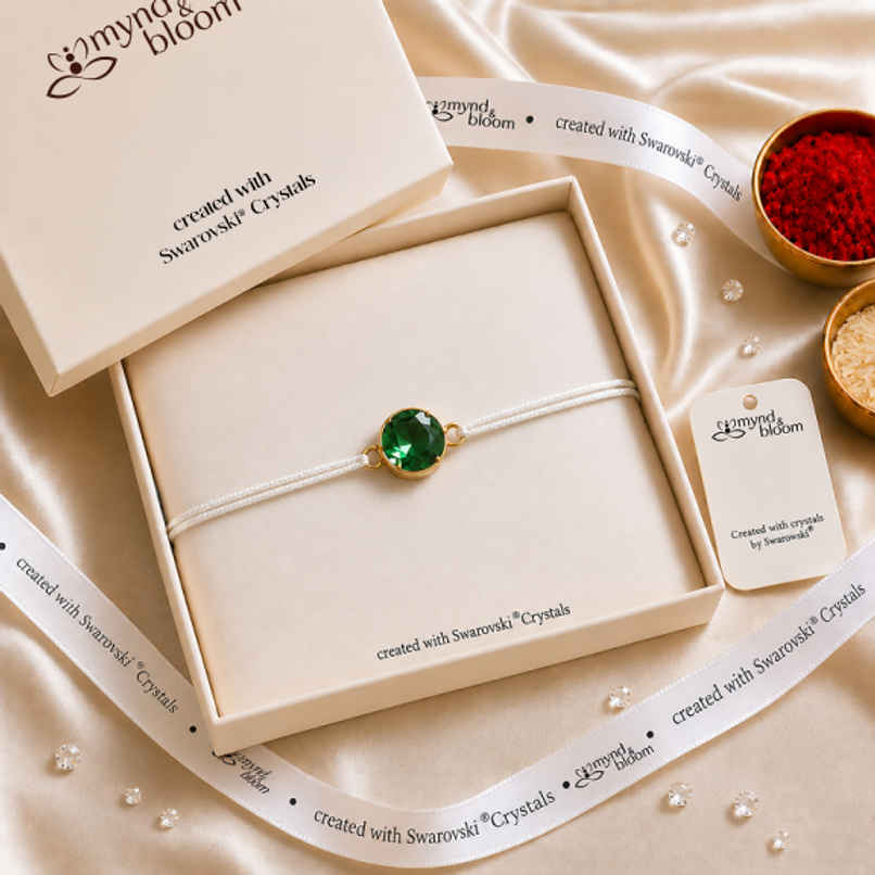 Created with Swarovski Crystals | Emerald Eclat Rakhi | Carat Gold Plating Created with Swarovski Crystals | Emerald Eclat Rakhi | Carat Gold Plating