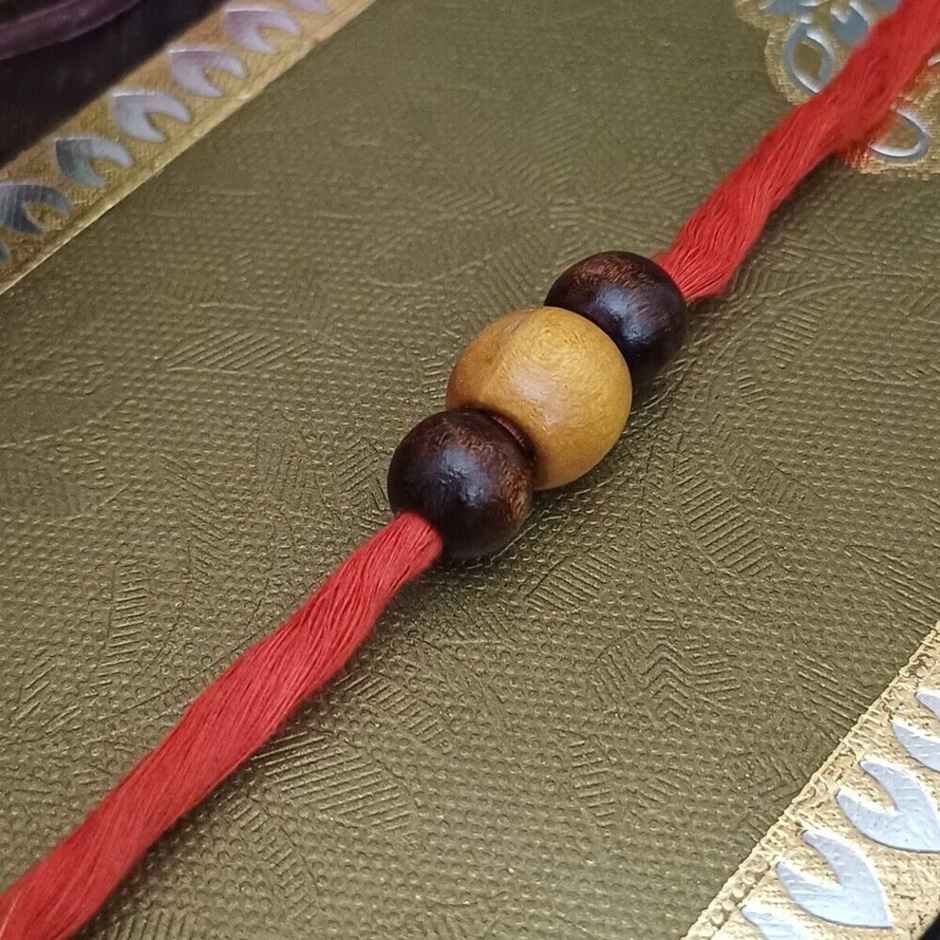 Lotte Choco Pie Chocolate Cake(168gms) & Red And Yellow Mauli Rakhi With Beads(1pc) Combo