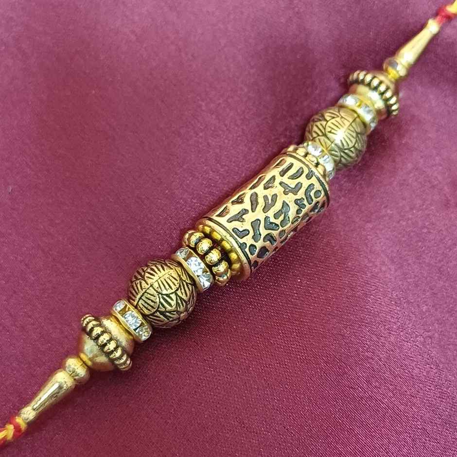 Antique Gold Taveej Rakhi | Traditional Design | Gullak