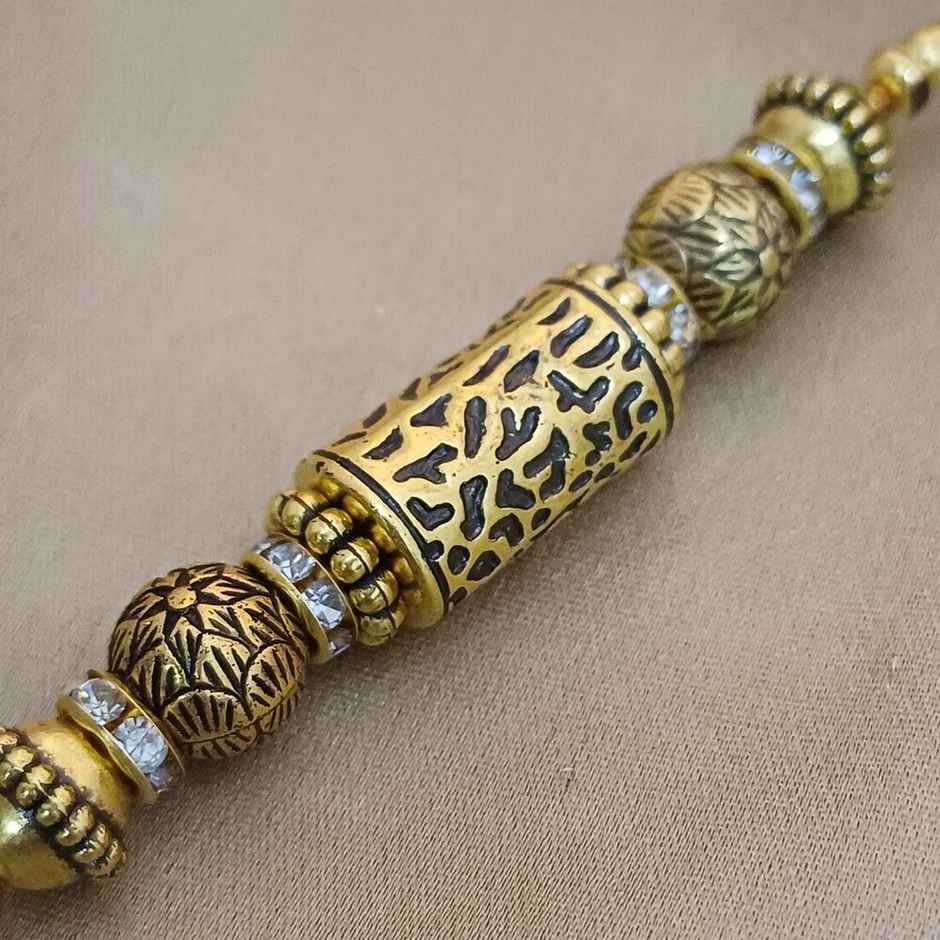Antique Gold Taveej Rakhi | Traditional Design | Gullak