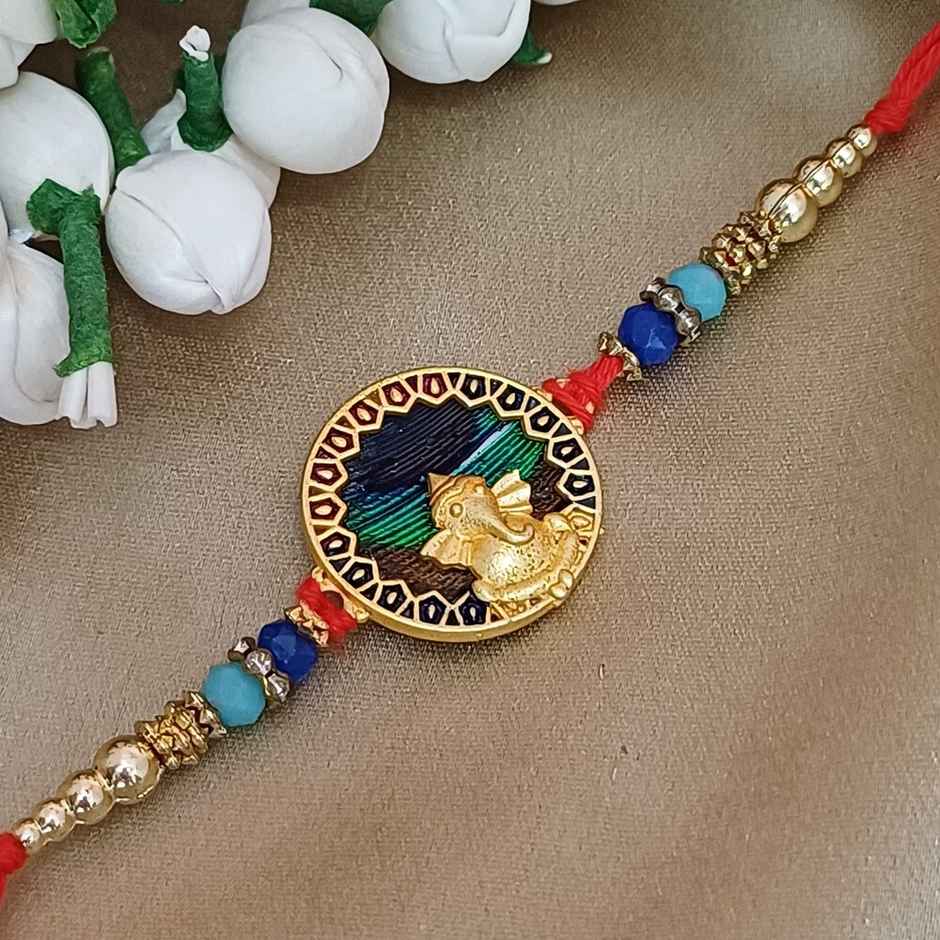 Matt Gold Metal Ganpati Round Frame Peacock Feather Rakhi | Divine and Beautiful | Gullak