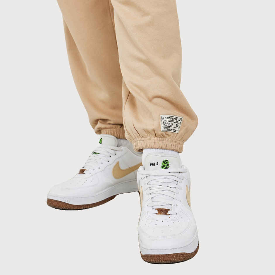 Styli Men's Relaxed Fit Jogger with Zip Pockets and Badge Detail | Beige - L