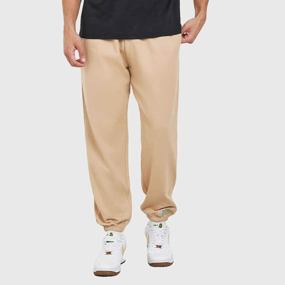 Styli Men's Relaxed Fit Jogger with Zip Pockets and Badge Detail | Beige - L