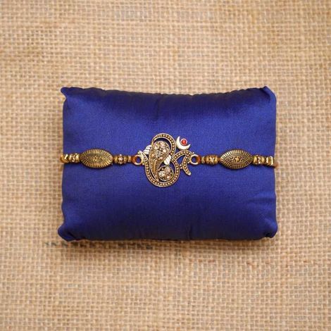 Religious Golden Beads, Om Symbol Designer Rakhi for Brother & Roli Chawal Pack (eCraftIndia)
