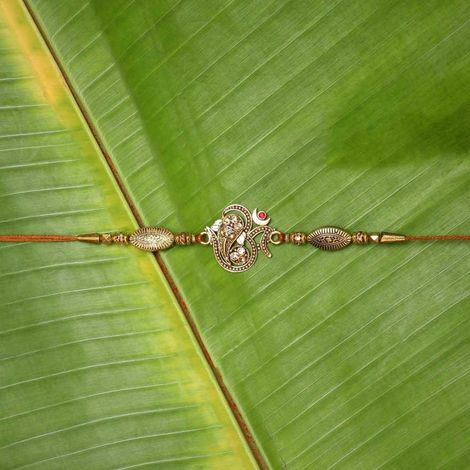 Religious Golden Beads, Om Symbol Designer Rakhi for Brother & Roli Chawal Pack (eCraftIndia)