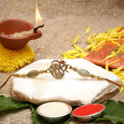 Religious Golden Beads, Om Symbol Designer Rakhi for Brother & Roli Chawal Pack (eCraftIndia)
