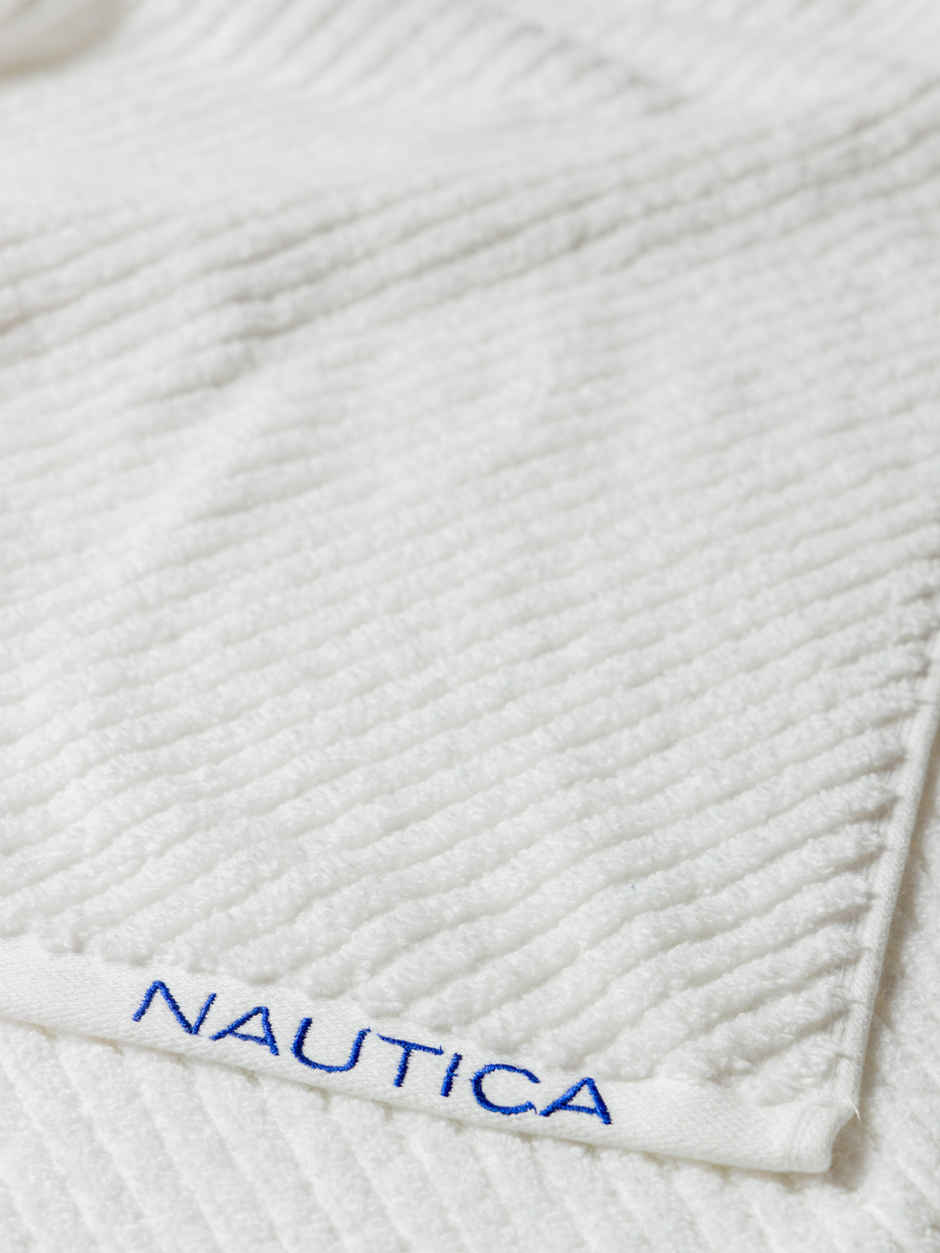 NAUTICA Fluffy Zero Twist 100 Percent Cotton Face Towel | Cross View | Solid White