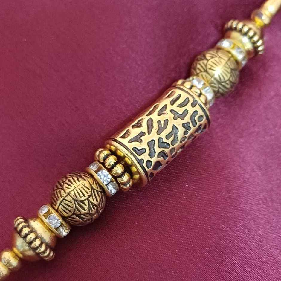 Antique Gold Taveej Rakhi | Traditional Design | Gullak