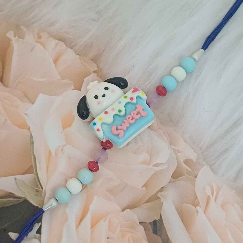 Gullak Puppy On Cake Blue White Kids Rakhi - Fun and Colorful