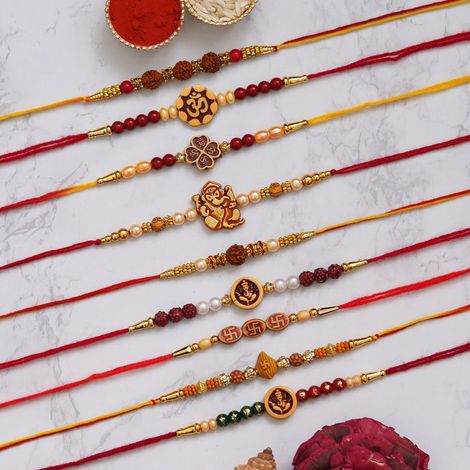 Religious Multicolor Om, Ganesha, Swastik, Rudraksha, Pearls Religious Designer Rakhis & Roli Chawal Pack (eCraftIndia) Set of 9