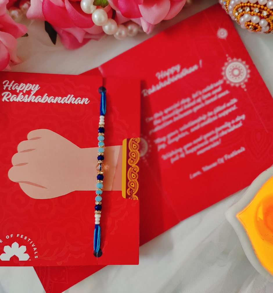 Amul Fruit 'N' Nut Chocolate(150gms) & Beautifully Weaved Dori Rakhi With Blue & White Shade Moti(1pc) Combo