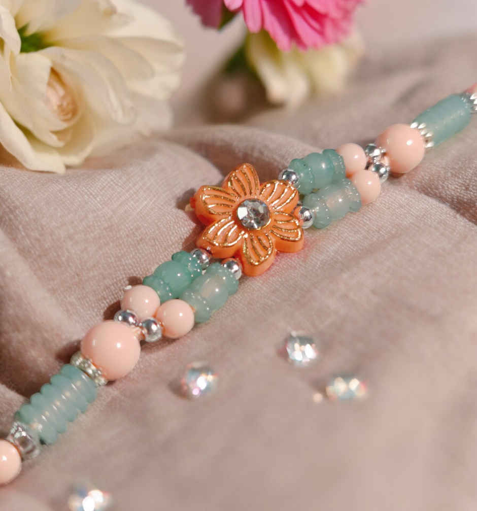 Daadi'S Besan Laddoo Pure Ghee(200gms) & Pastle Green & Pink Flower Design Rakhi(1pc) Combo