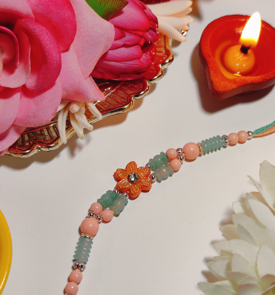 Daadi'S Besan Laddoo Pure Ghee(200gms) & Pastle Green & Pink Flower Design Rakhi(1pc) Combo