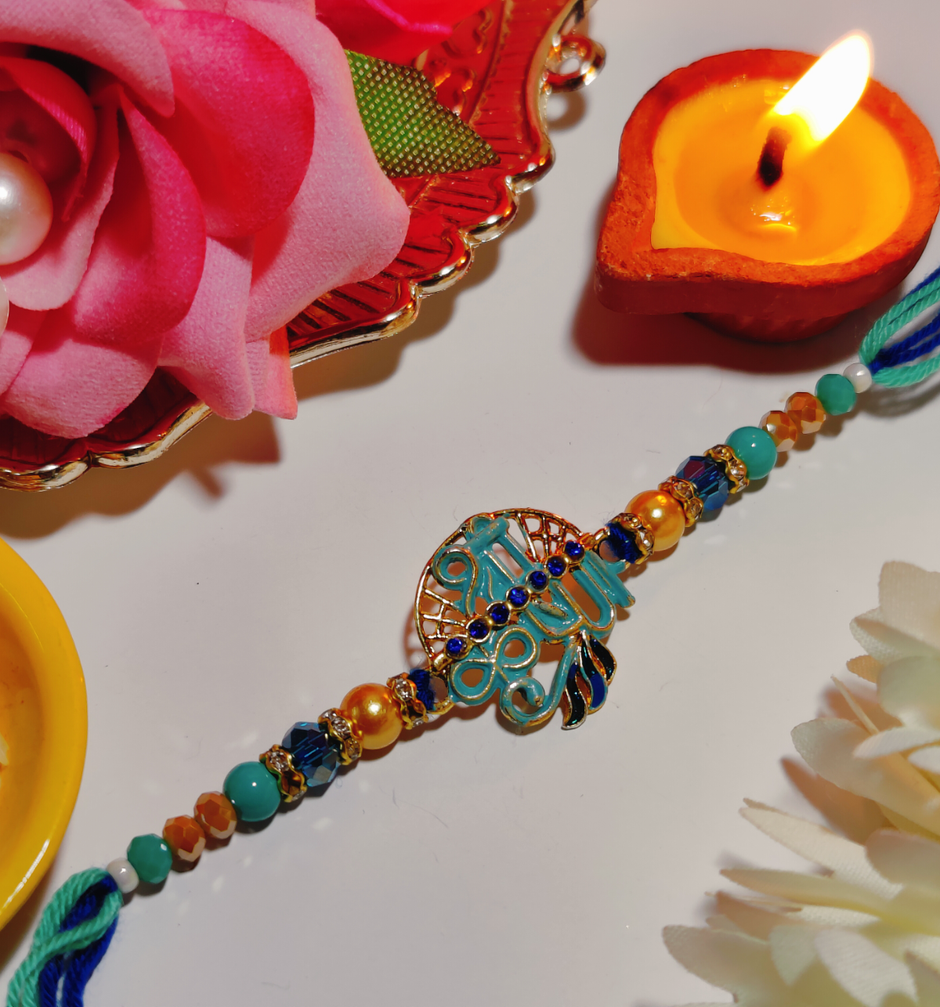 UNIBIC Swaadesi Shahi Kaju Katli Box(240Gms) & Blue Shade Shree Krishna Metal Pendant Rakhi With Moti(1Pc) Combo