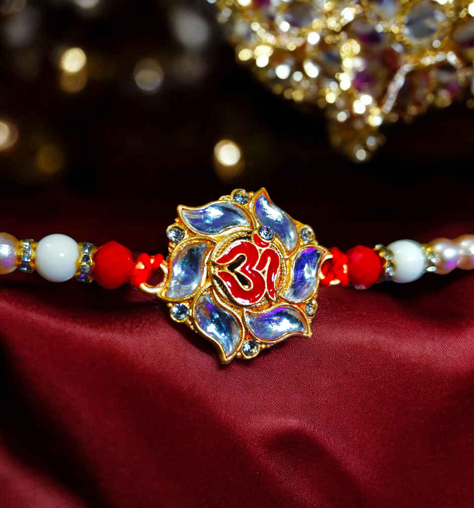 House Of Festivals Premium White Om Pendant Rakhi With Red Moti - Spiritual and Premium