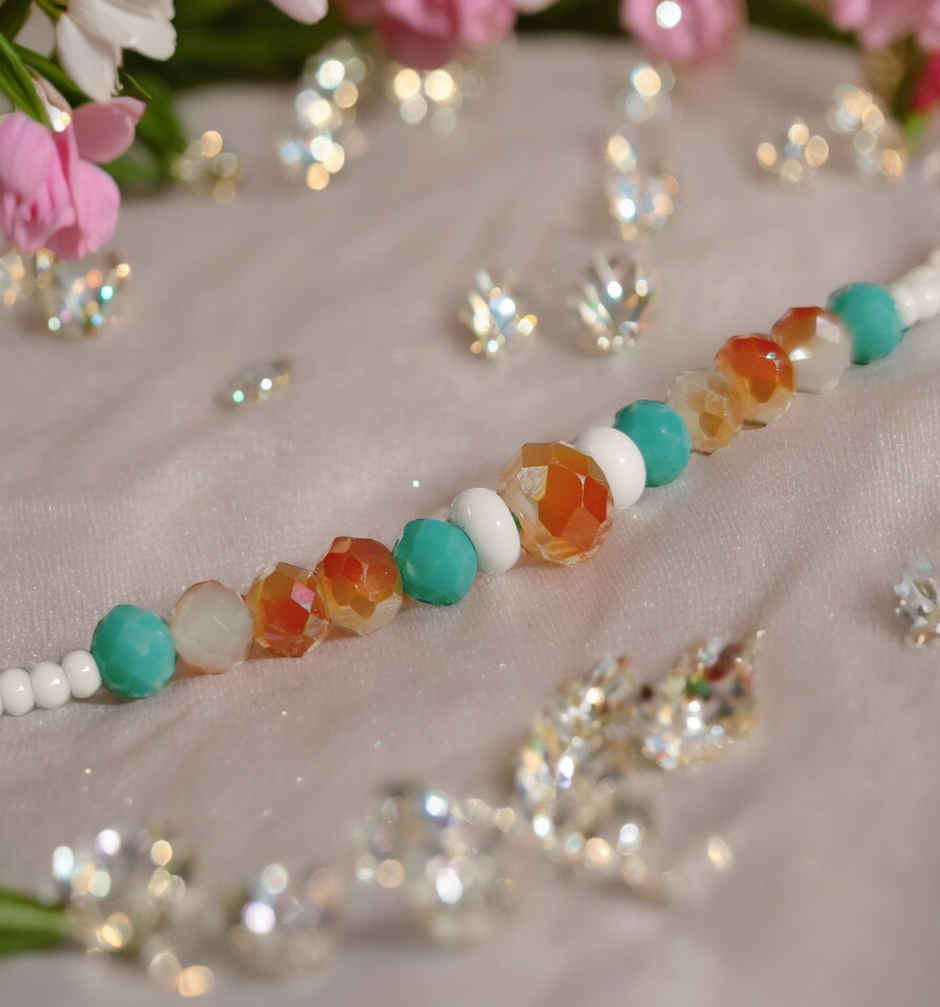 Ferrero Rocher Moments Gift Box(185gms) & Beautifully Weaved Dori Rakhi With Pastle Green & White Color Moti(1pc) Combo