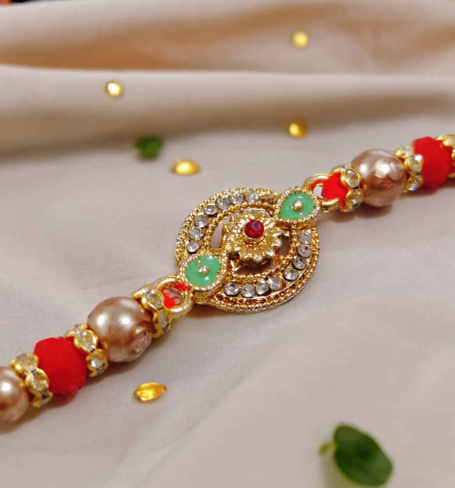 House Of Festivals Designer Rakhi with Traditional Circular Pendant & Moti - Artistic Craft