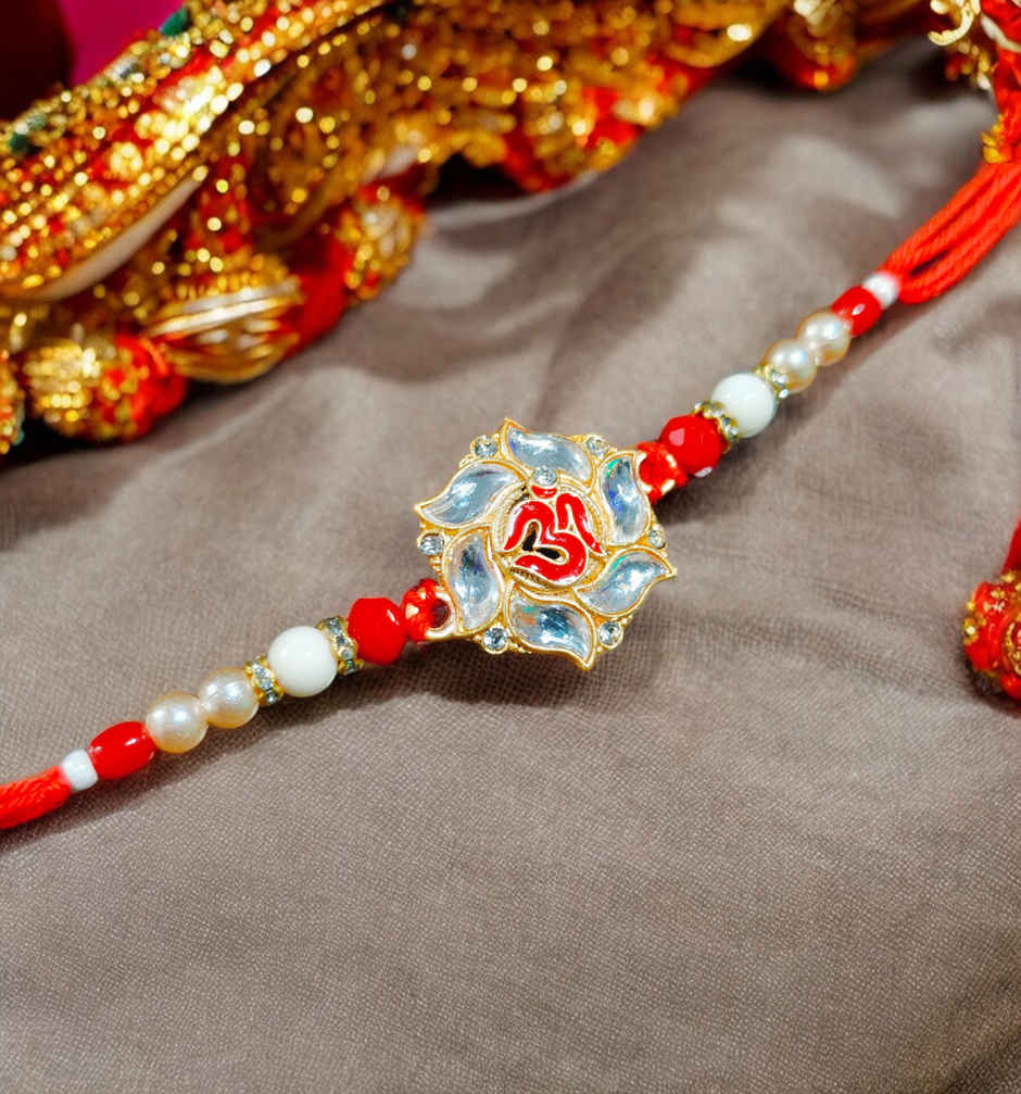House Of Festivals Premium White Om Pendant Rakhi With Red Moti - Spiritual and Premium