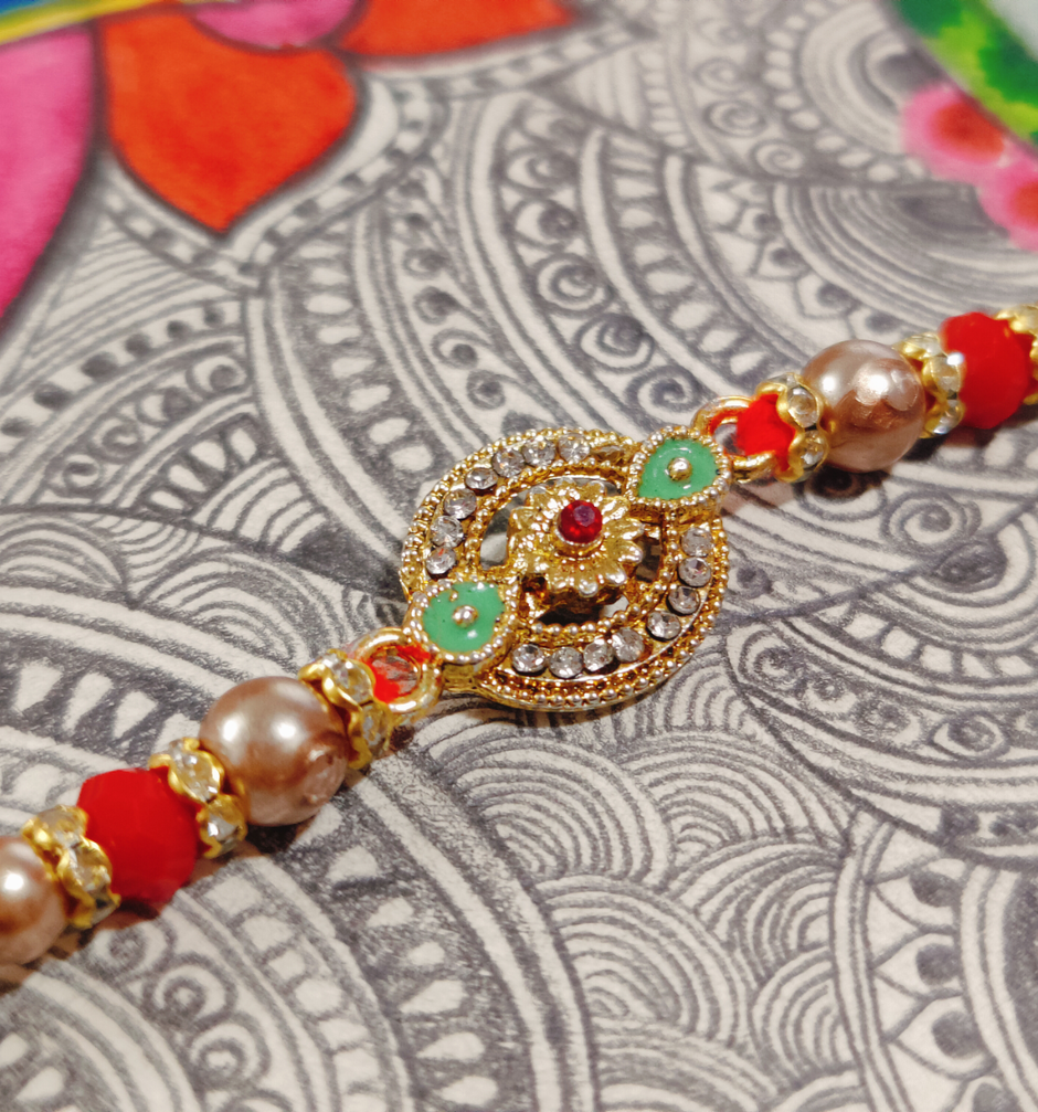 House Of Festivals Designer Rakhi with Traditional Circular Pendant & Moti - Artistic Craft