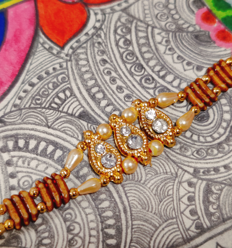 House Of Festivals Ambi Shaped Kundan Work Traditional Sequence Rakhi - Artistic Craft