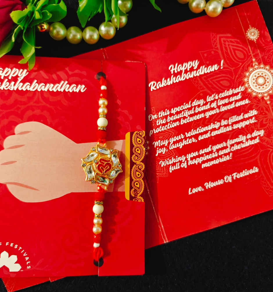 House Of Festivals Premium White Om Pendant Rakhi With Red Moti - Spiritual and Premium