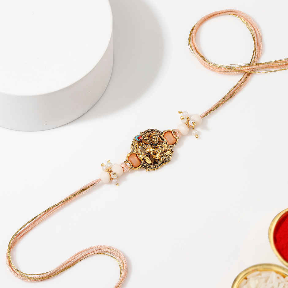 Krishna Devotional Pearl Thread Rakhi | IGP