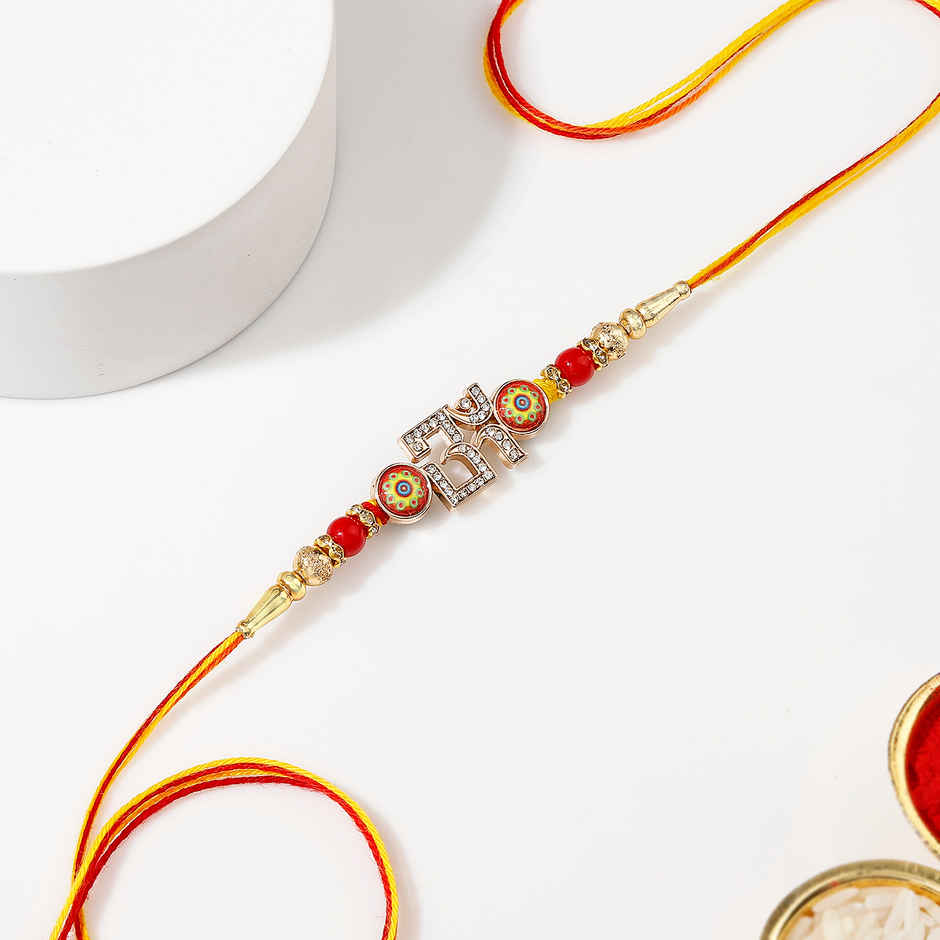 Crystal Studded Om Red & Golden Rakhi | IGP