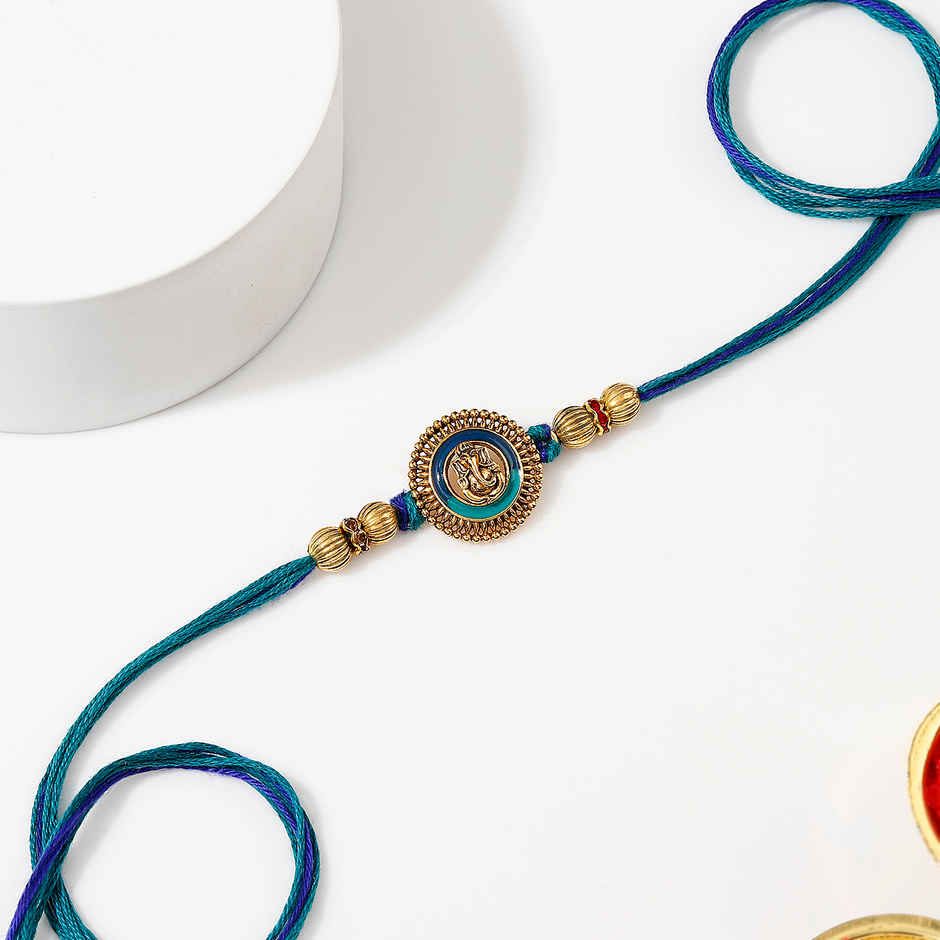Devotional Ganesha Antique Dial Rakhi | IGP