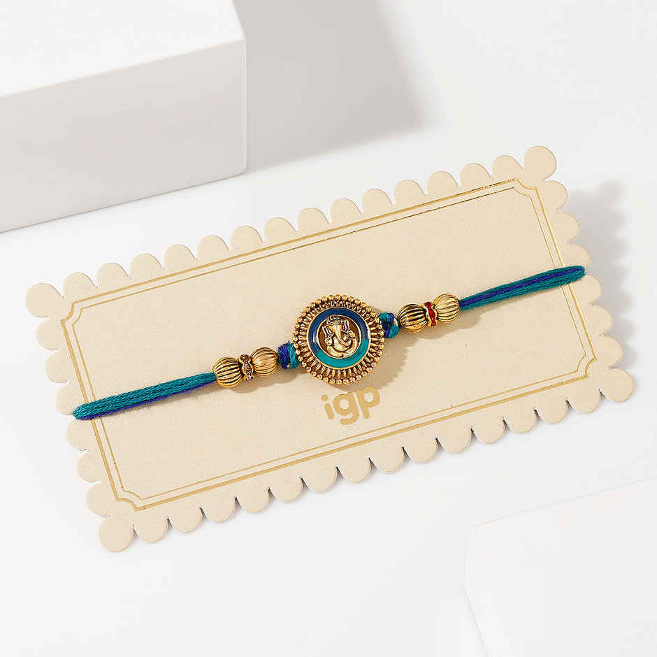 Devotional Ganesha Antique Dial Rakhi | IGP