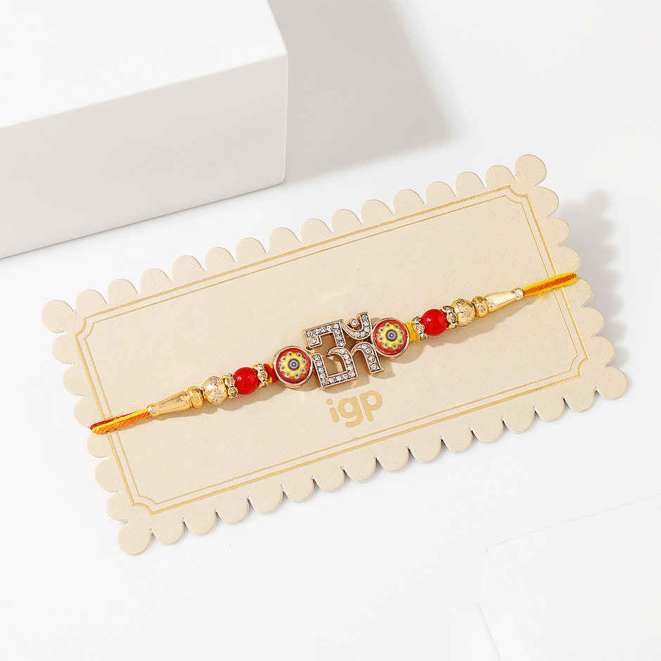 Crystal Studded Om Red & Golden Rakhi | IGP