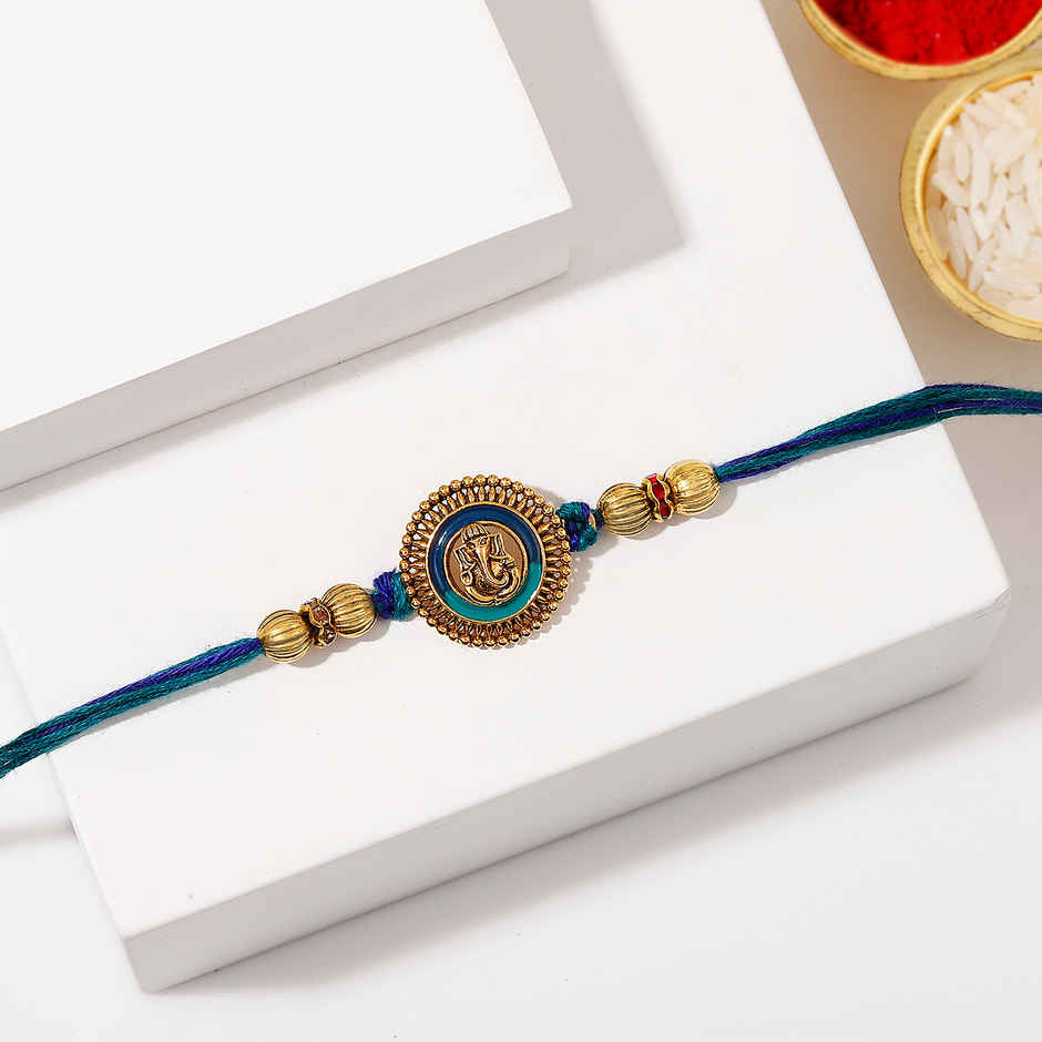 Devotional Ganesha Antique Dial Rakhi | IGP