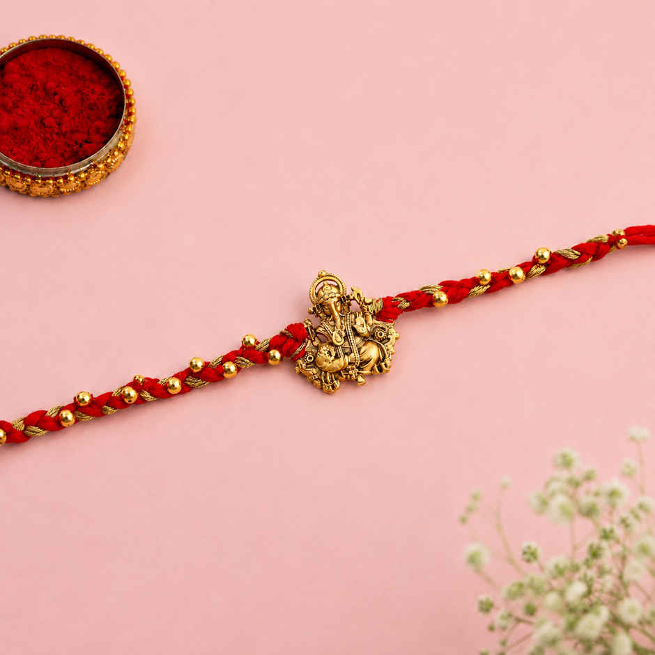 Rakhi for Brother | Divine Red Thread Ganesh | Religious | Pack of 1 |Included Roli Chawal | Voylla